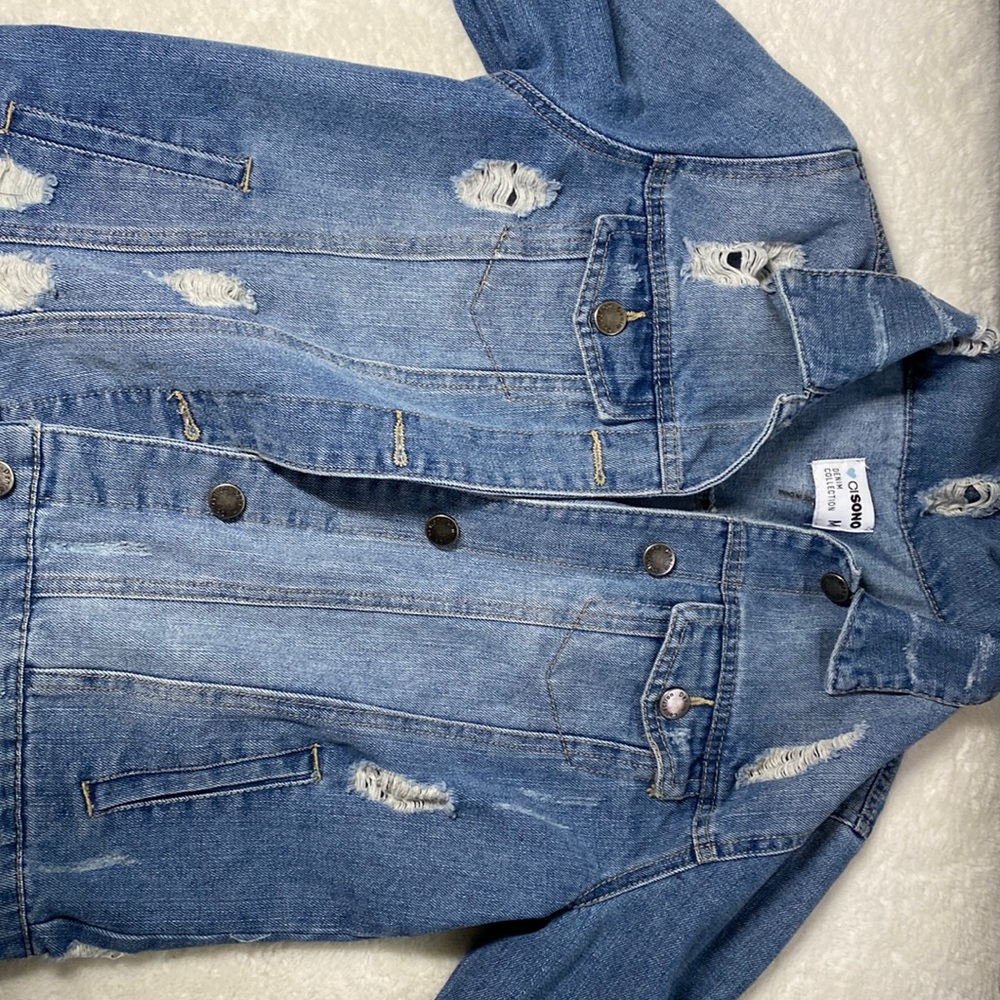Distressed denim jacket